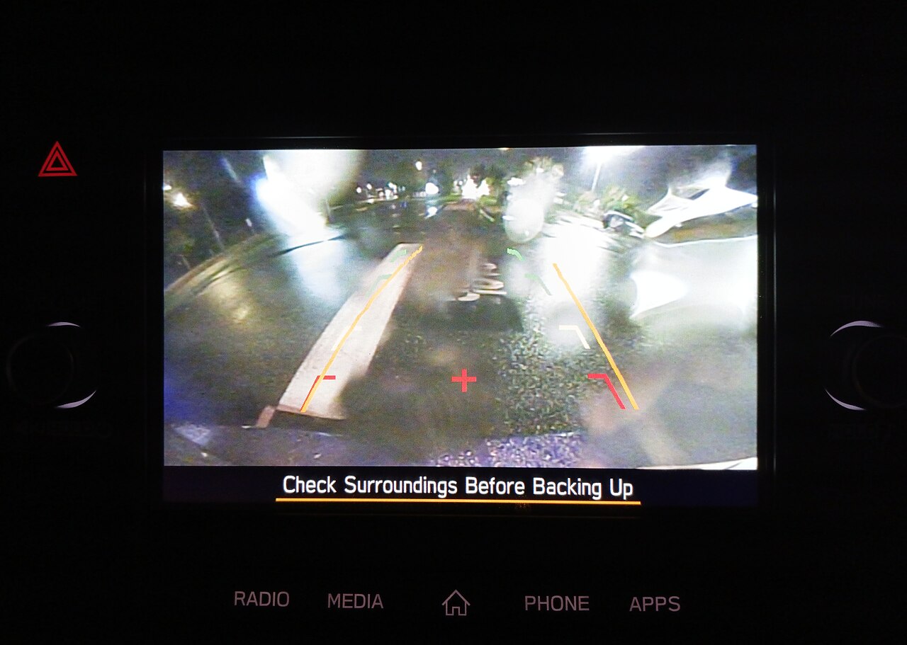Reversing camera display at night with the lens beaded and smeared by rain