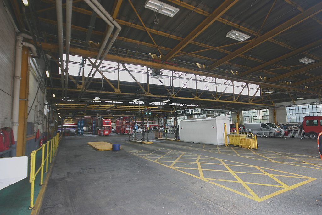 The flat marked floor inside a bus garage