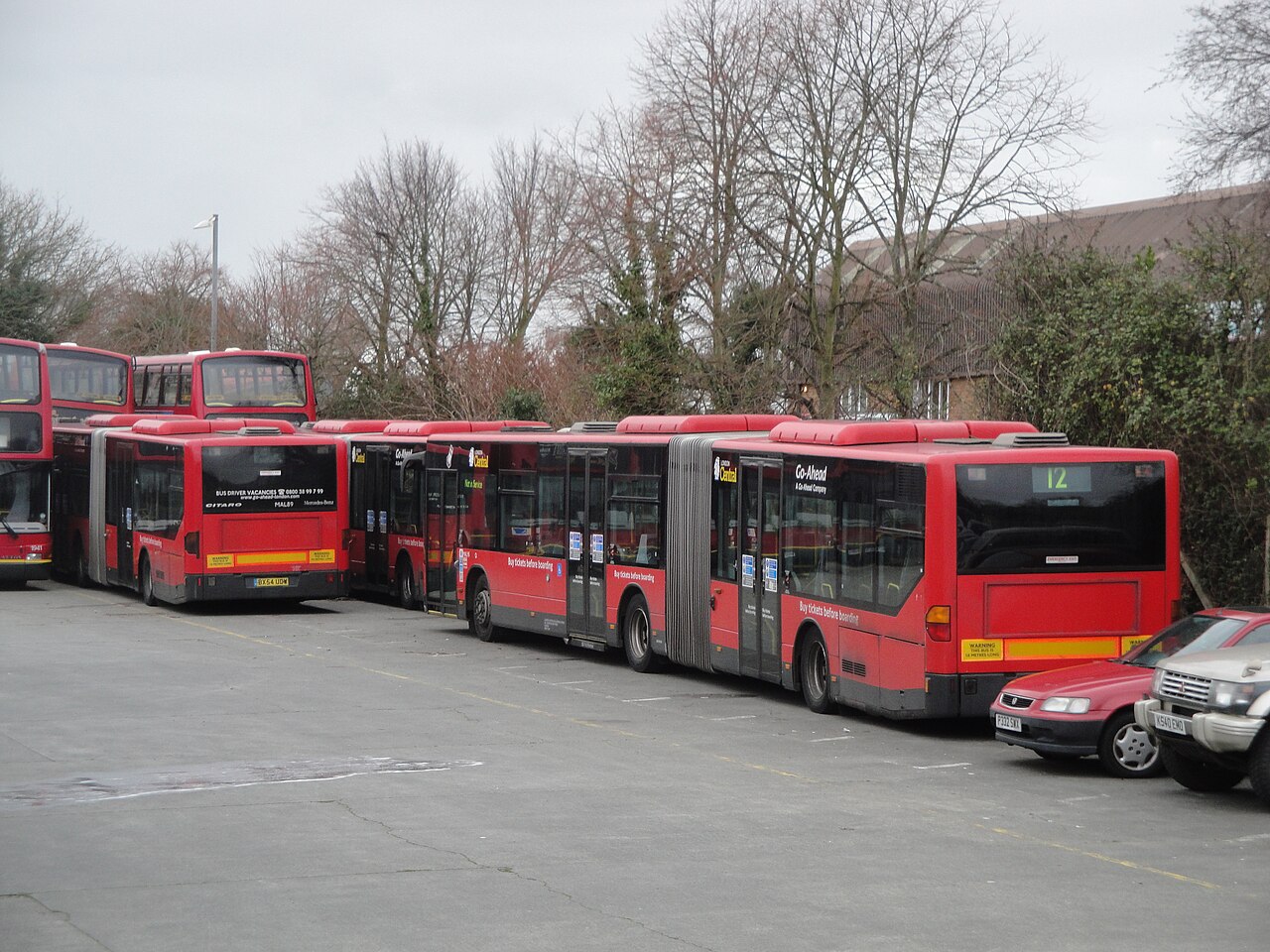 Articulated bus fleet parked at a depot
