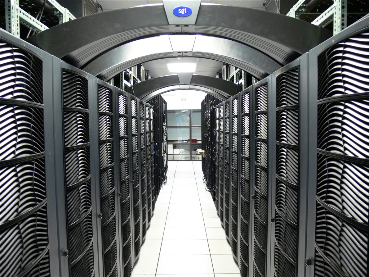 An aisle of server racks in a data centre