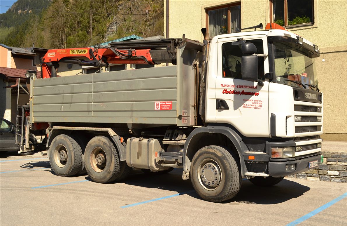 White Scania 124c tipper truck with a loader crane