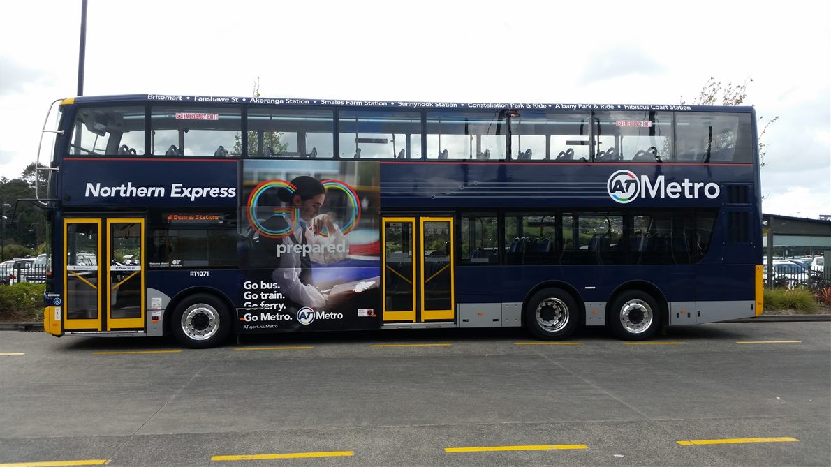 Double-decker bus side view on a marked parking area, body over four meters tall