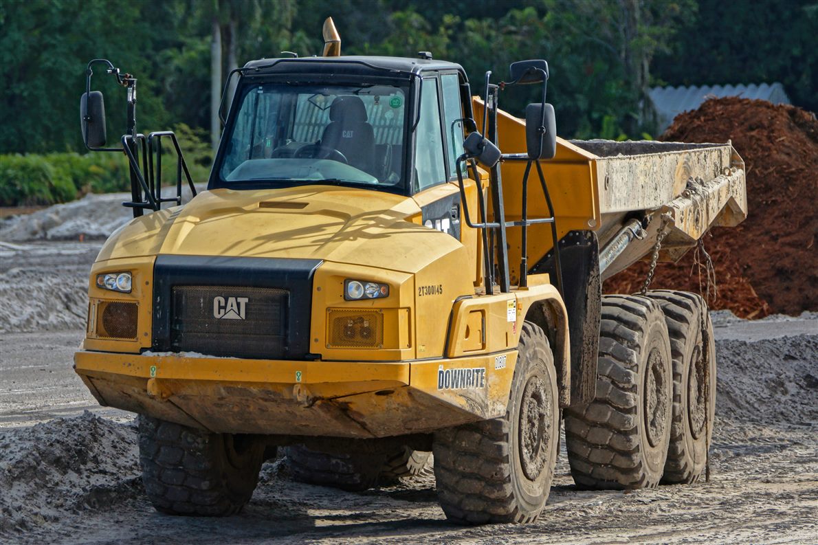 Caterpillar articulated dump truck on a muddy site