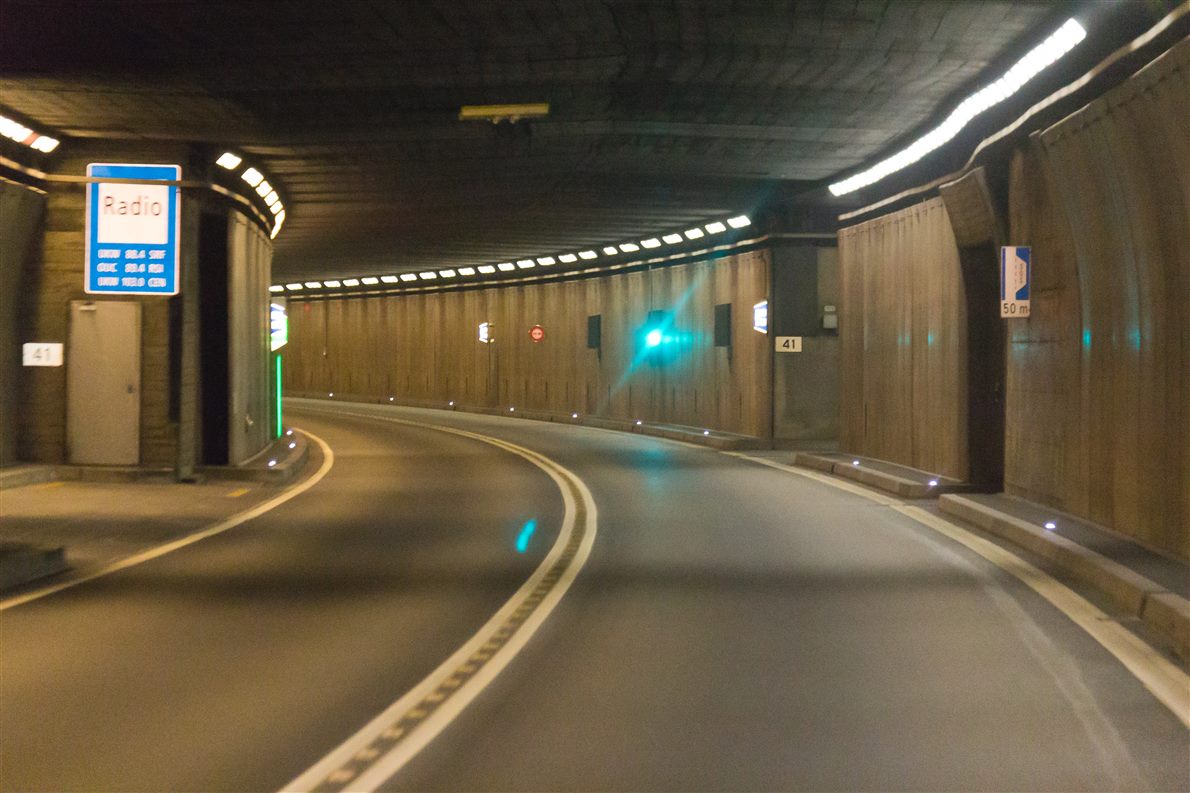 Inside a road tunnel with a roadside radio rebroadcast sign