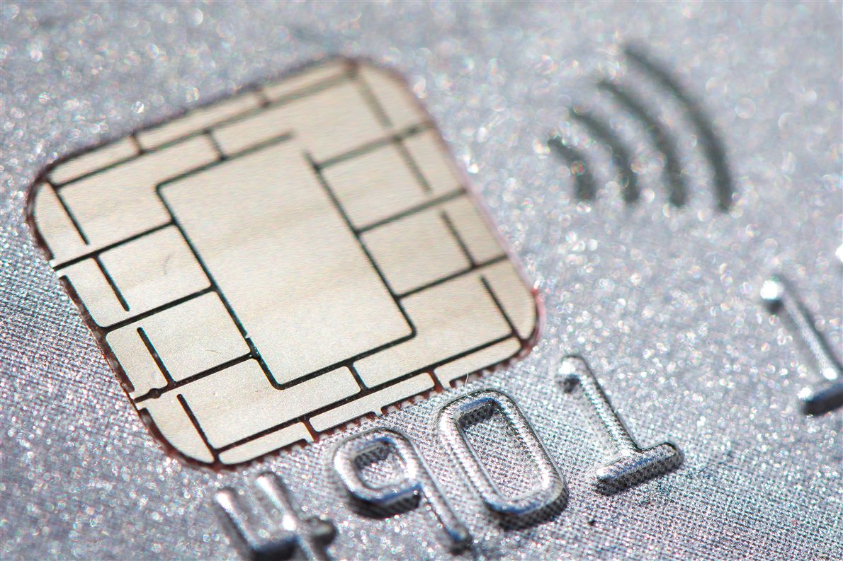A secure element chip on a bank card in macro